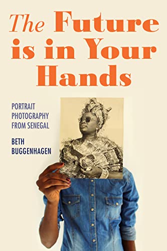 Book cover featuring a Senegalese woman in traditional headwear and clothing.