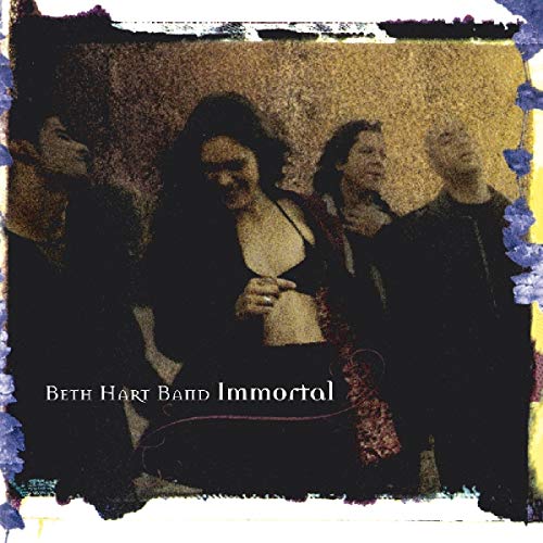 "Album cover with dark-toned image of a woman and three men, titled 'Beth Hart Band Immortal'."