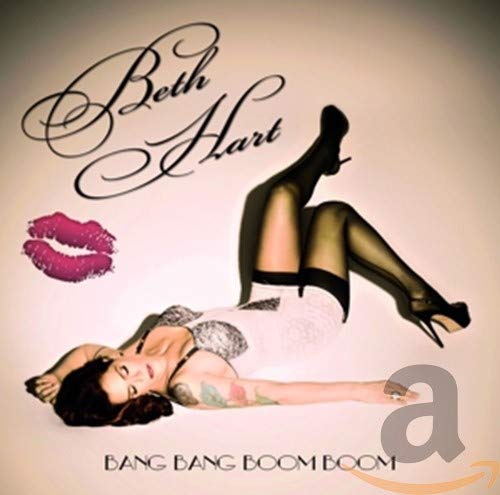 Beth Hart lying on her back in lingerie with a pink kiss icon nearby.