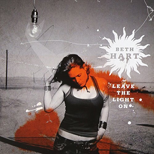 "Beth Hart album cover featuring a woman in a black tank top with red and white accents."