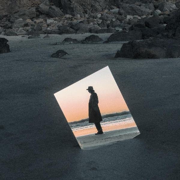 Beth Orton album cover: silhouetted figure on a beach, framed by light.
