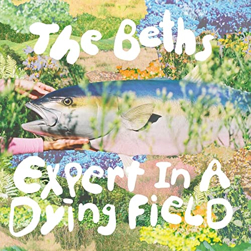 Hands hold a large fish against a collage background of flowers and foliage.