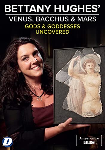 Bettany Hughes beside a framed fragment of ancient Roman art.