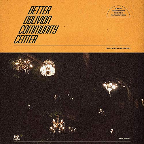 Vinyl cover with orange top section and dark night scene with glowing chandeliers below.