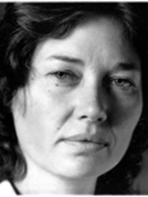 Black and white portrait of a woman, close-up, looking forward.