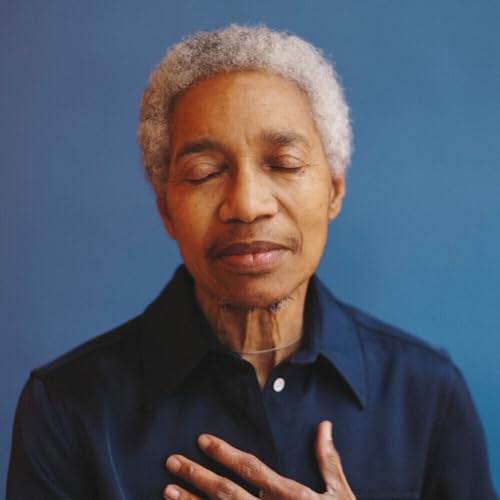 Close-up portrait of Beverly Glenn-Copeland with eyes closed, wearing dark blue.
