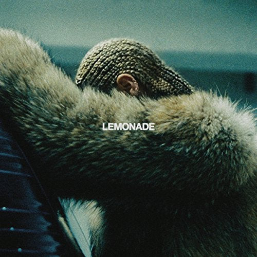 Beyoncé’s “Lemonade” album cover: person in fur, head covered, teal background.