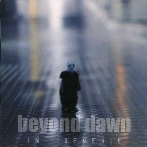 CD cover: blurry figure walking down a wet, city street.