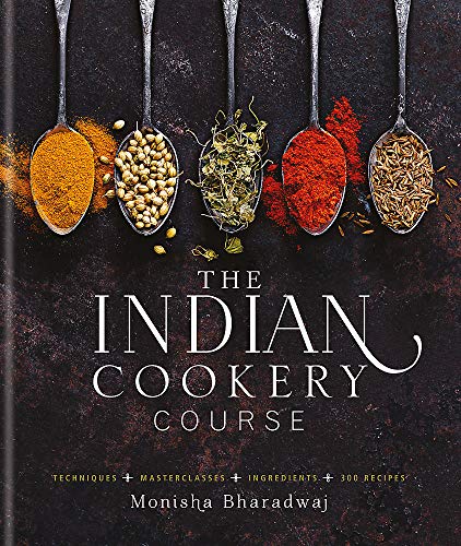 Book cover for The Indian Cookery Course featuring five spoons of spices on dark background.