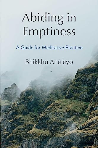 Book cover with title “Abiding in Emptiness” and misty mountain scene.