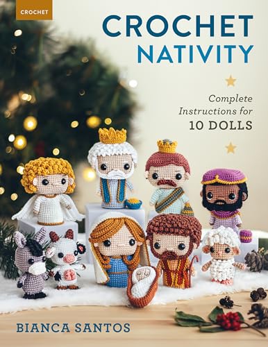 Crochet nativity scene with ten handmade dolls, including baby Jesus.