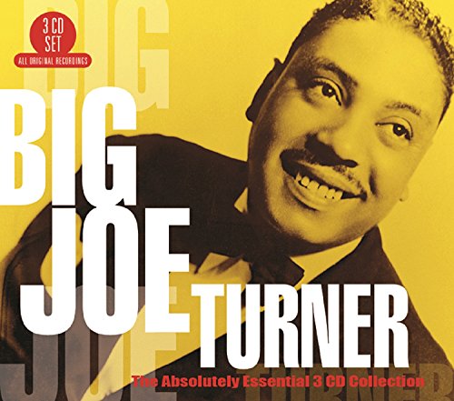 "CD cover featuring a smiling man in a suit against a yellow background."