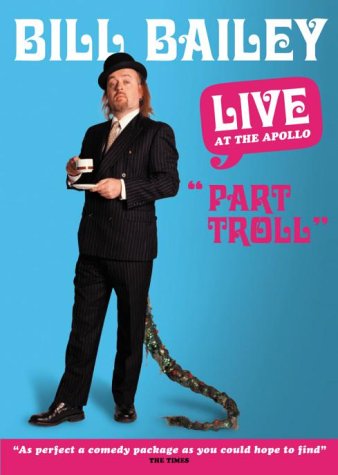 Bill Bailey in suit and hat, with a long, colorful troll tail.