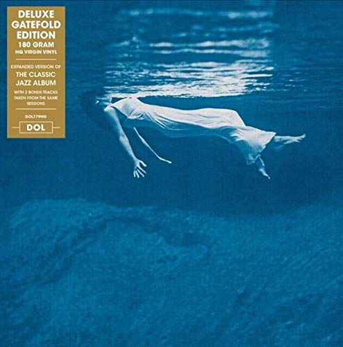 Vinyl album cover: a person floating underwater in a blue tone.