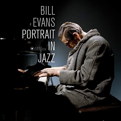 Bill Evans album cover: pianist in coat at a piano.