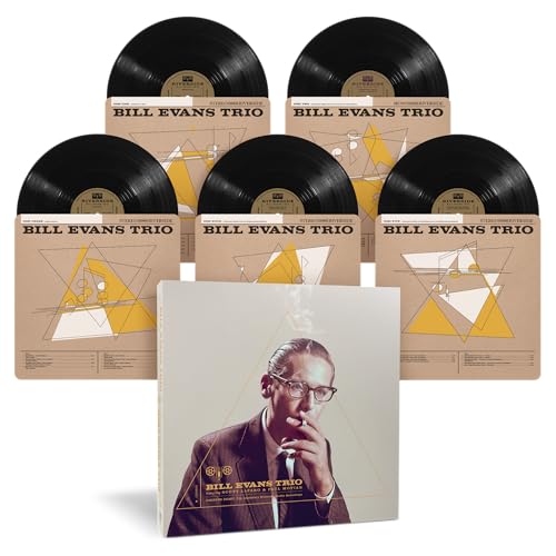 Six vinyl records and a cover featuring Bill Evans in a suit.