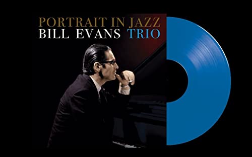 Bill Evans Trio Portrait in Jazz album cover next to a blue vinyl record.