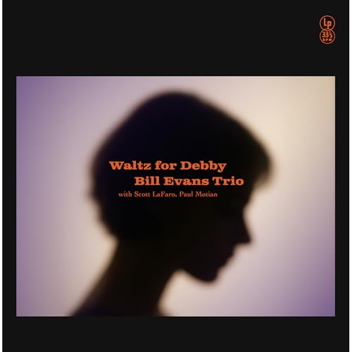 Vinyl album cover featuring a blurred silhouette of a woman against a light background.