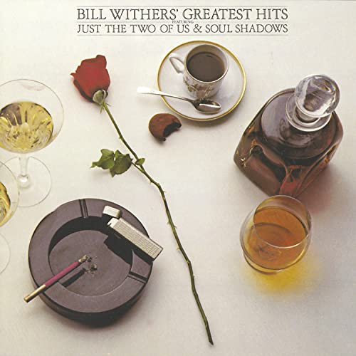 Album cover with still life of drink, cigarette, and single rose on white surface.