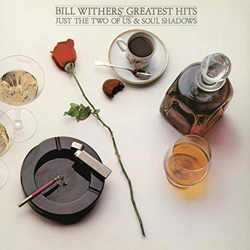 Bill Withers’ “Greatest Hits” vinyl cover with drinks and a rose.