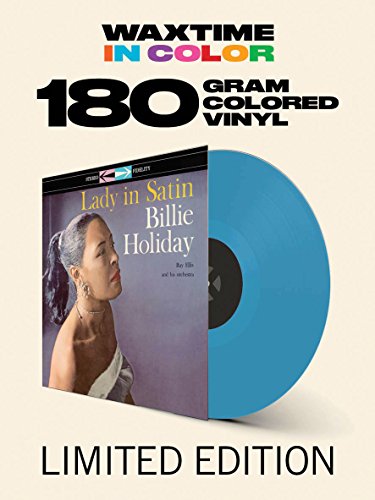 "Album cover featuring Billie Holiday in a white dress, with title and artist name."