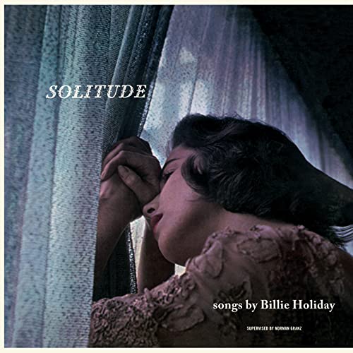 Billie Holiday album cover, "Solitude," showing a woman’s face and hands.