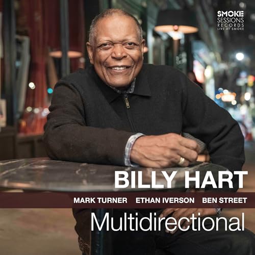 Billy Hart smiling, leaning on a table, with album title Multidirectional and artist names.