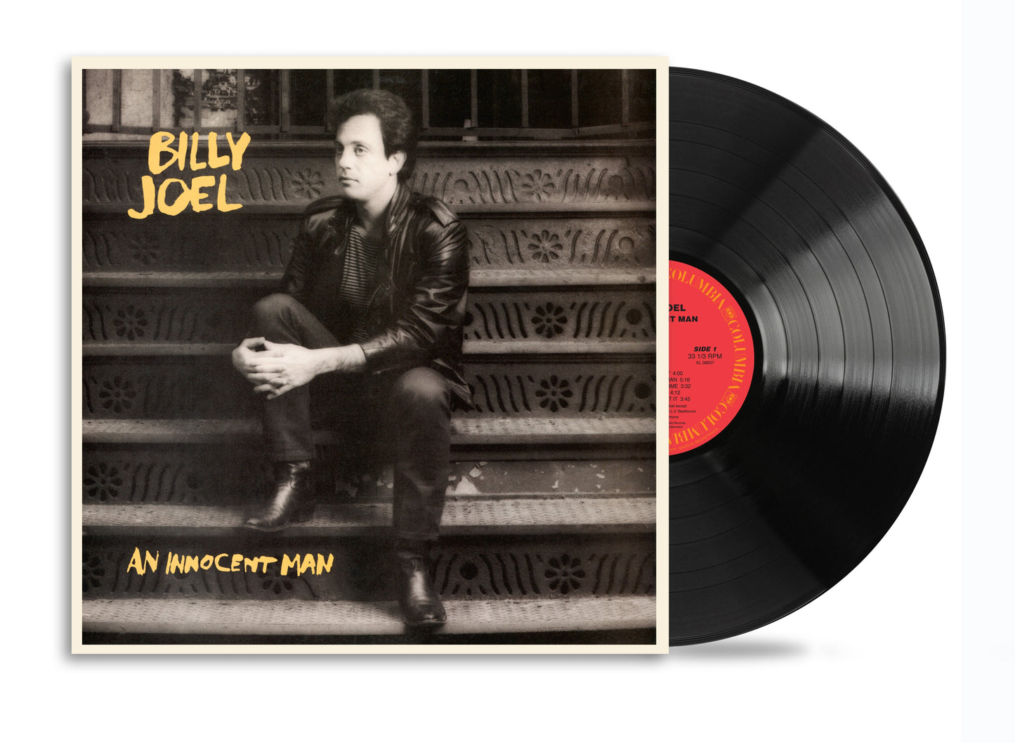 Billy Joel album cover with a portrait and black vinyl record.