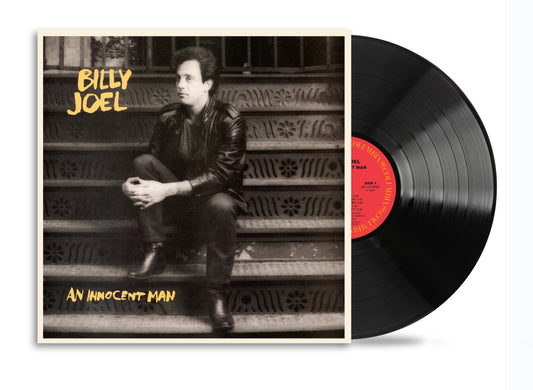Billy Joel album cover with a portrait and black vinyl record.