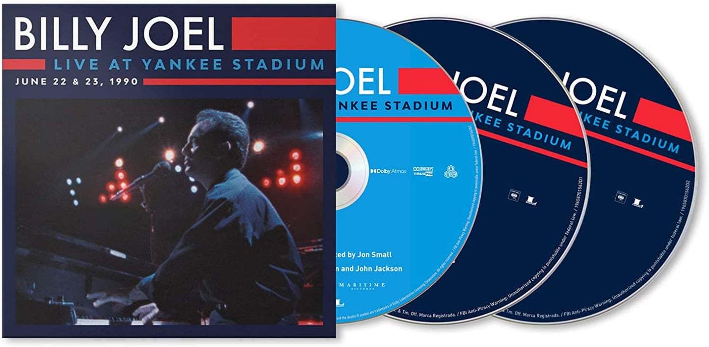 "Billy Joel album cover featuring a man singing into a microphone on stage."