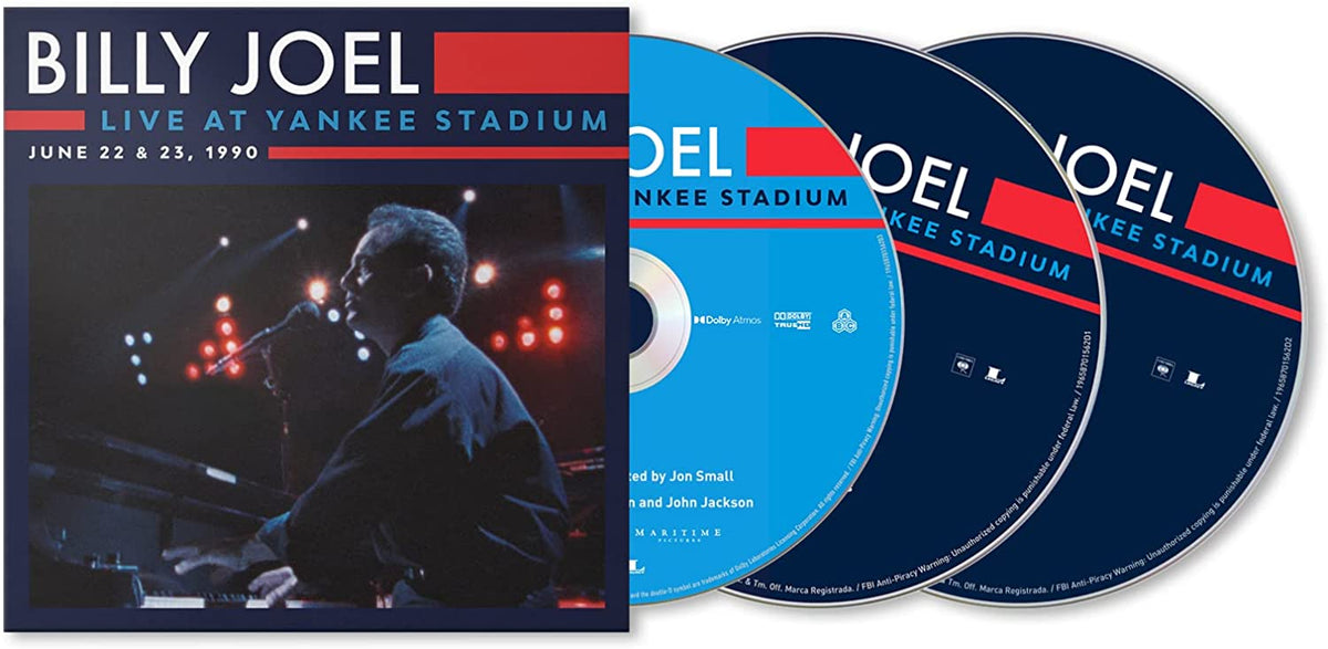 "Billy Joel album cover featuring a man singing into a microphone on stage."