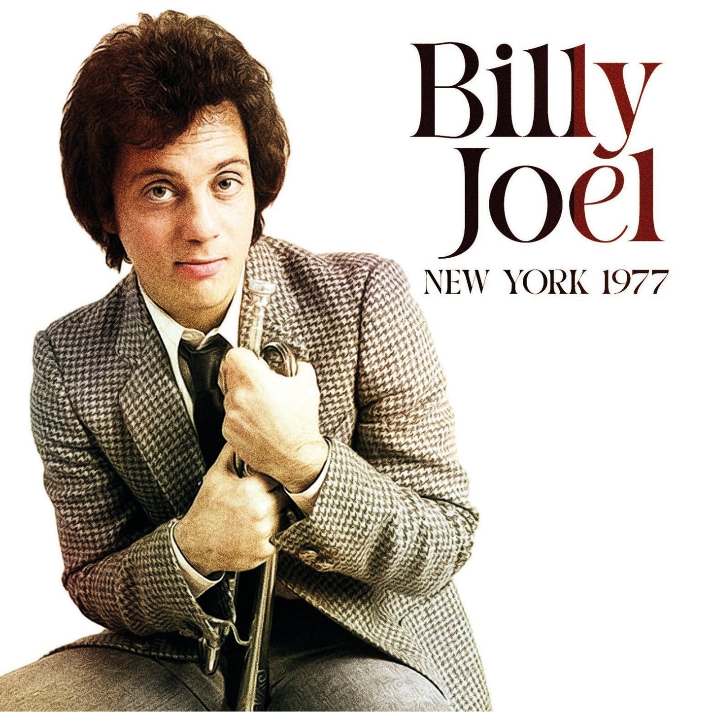 Billy Joel album cover, portrait of singer in a tweed jacket.
