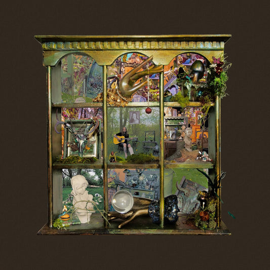 Ornate cabinet diorama featuring a musician with a guitar.