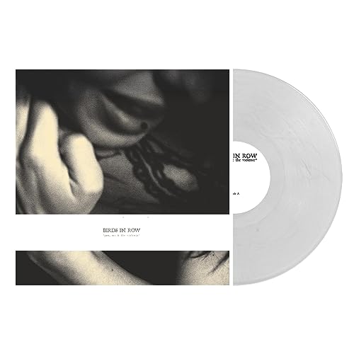 Vinyl record with a grayscale album cover depicting a person’s face.