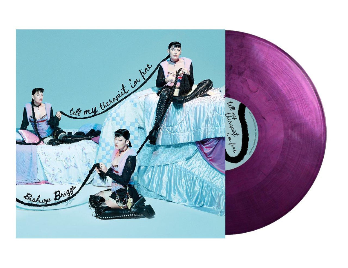 Bishop Briggs album cover with artist portrait and purple vinyl record.