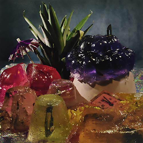 Album cover with colorful gelatin, a pineapple, and a small umbrella.