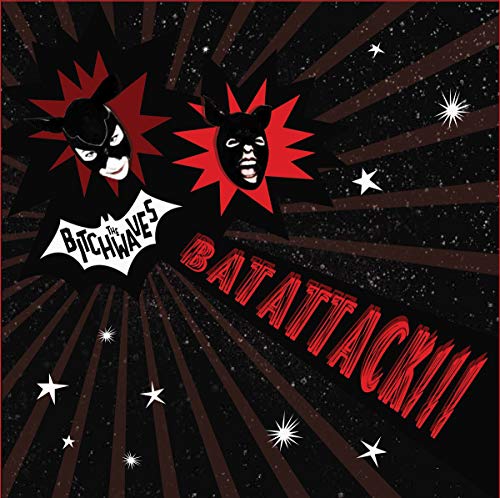 Record cover with two masked figures resembling bats against a starfield.