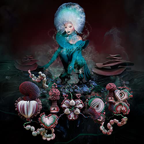 Björk in teal attire with a large, pale blue hairstyle and fungal growths.