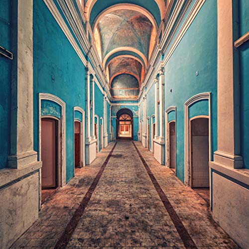 Long, ornate blue hallway with arched doorways and a distant opening.