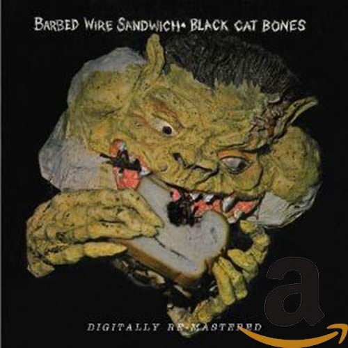 CD cover: grotesque monster eating a sandwich, dark background.
