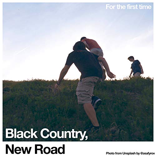 CD cover: three figures on a grassy hill under a bright sky.