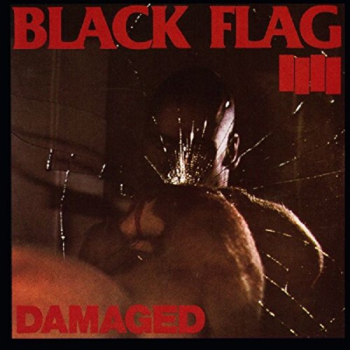 Black Flag “Damaged” album cover: cracked red glass and a silhouetted figure.