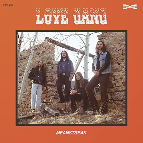 Vinyl record cover: four men with long hair stand before stone ruins.