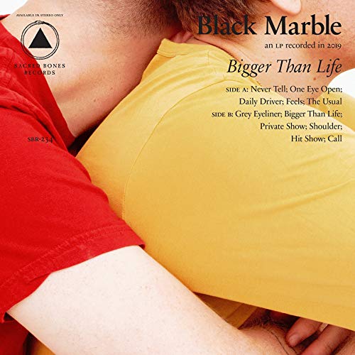 "Album cover with two men embracing, one in red, one in yellow shirt."