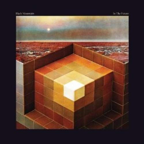 Black Mountain album cover: geometric cubes and a hazy sunset landscape.