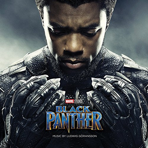 Chadwick Boseman as Black Panther, close-up, with film logo and composer credit.