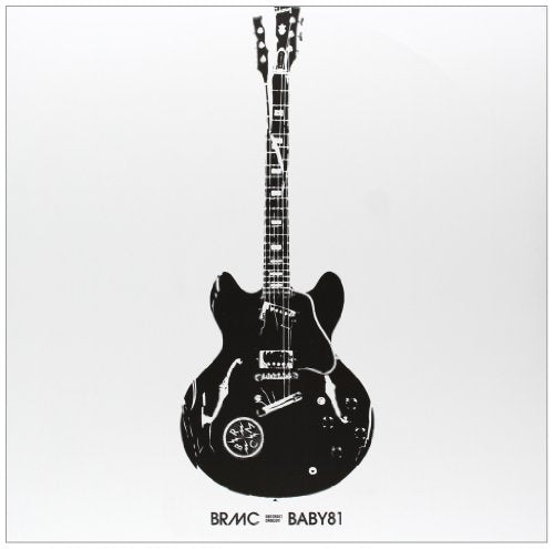 Black and white image of an electric guitar against a light background.