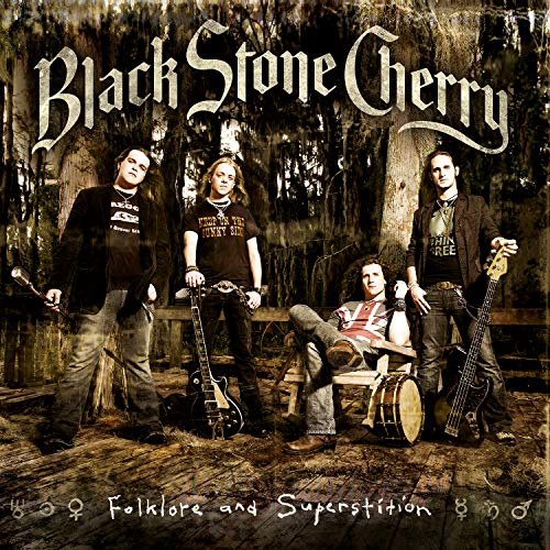 "Album cover featuring the band Black Stone Cherry in a forest setting."