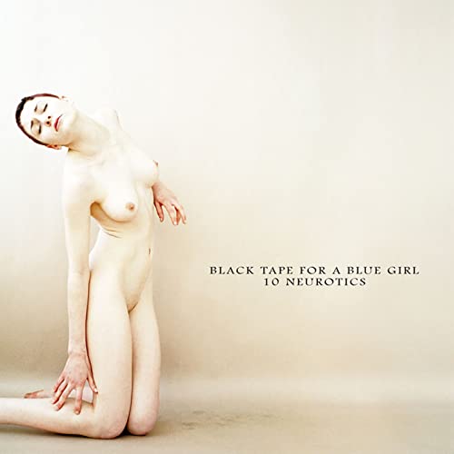 Nude woman in a contorted pose against a pale background.