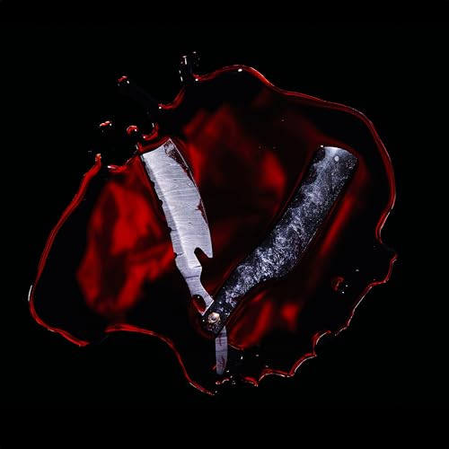 Straight razor in red liquid against a black background.